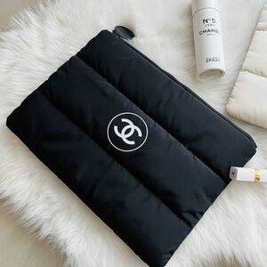 Chanel black puffy Logo zip Clutch sealed. New! Large size.